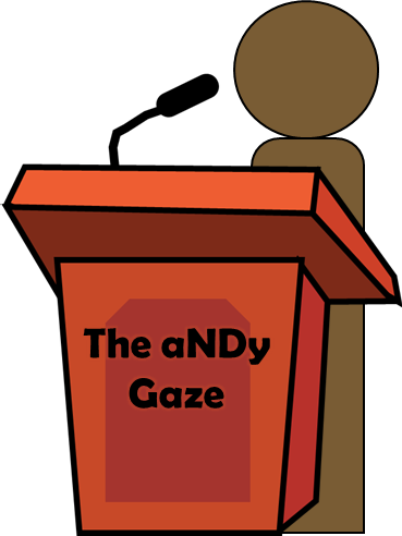 Picture of a cartoon debate podium with the words ‘The aNDy Gaze’ on it and a simple cartoon character standing by it.

